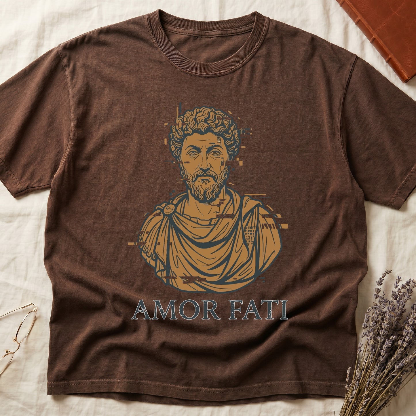 Espresso tee with bearded Stoic bust portrait in copper and slate, "AMOR FATI" in distressed serif capitals below.