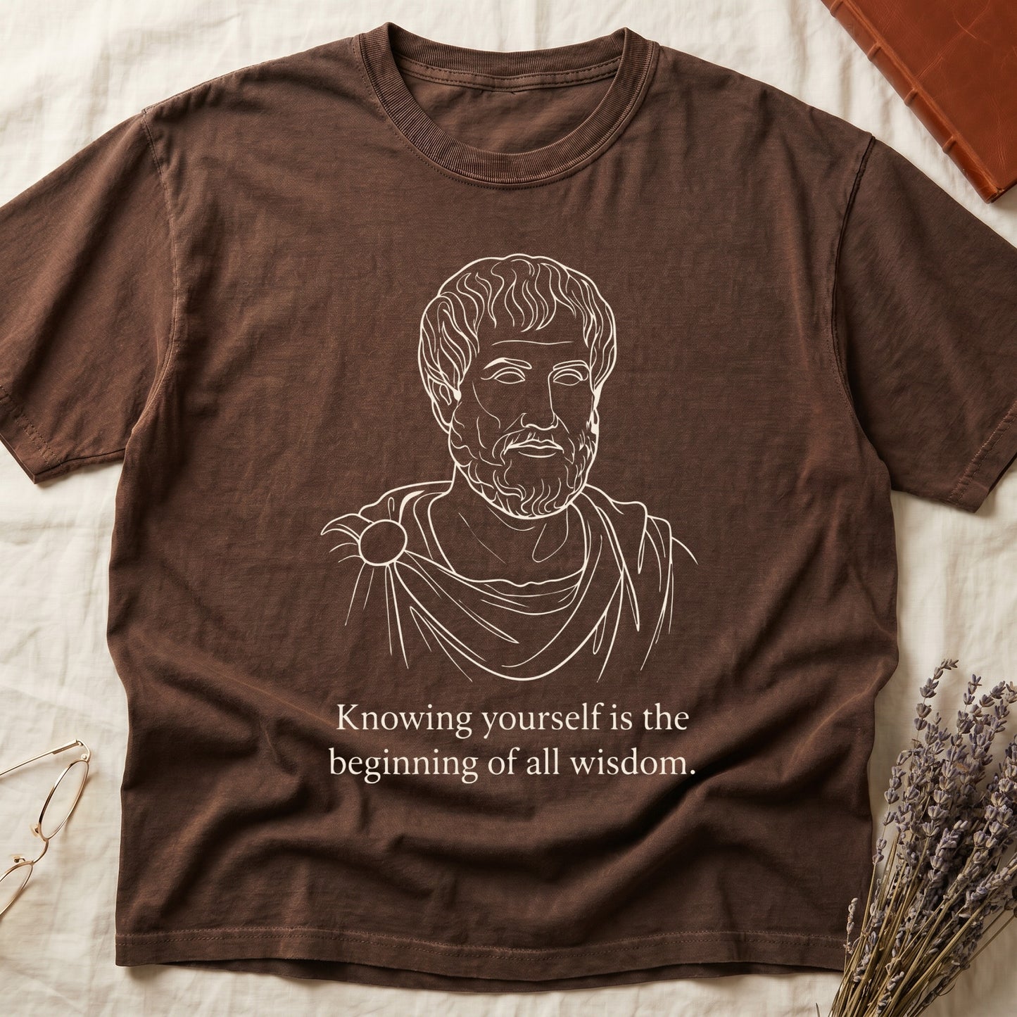Espresso tee with classical philosopher bust in cream linework, "Knowing yourself is the beginning of all wisdom" below.