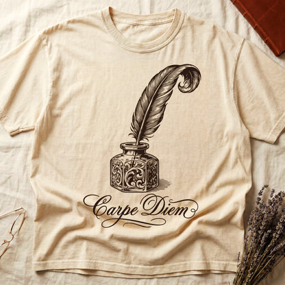 Ivory tee with ornate antique inkwell and quill pen in sepia linework, "Carpe Diem" in flowing cursive below.