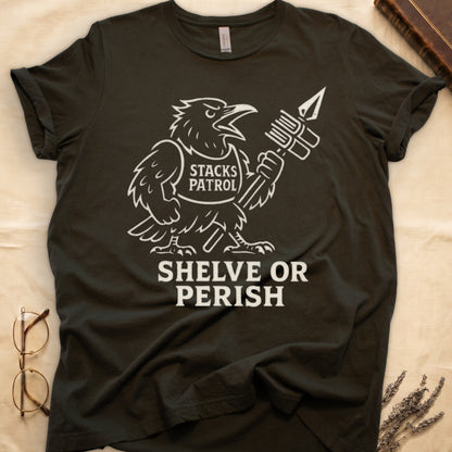 Military Green tee with vintage raven mascot, "STACKS PATROL" sash, feather pen aloft, "SHELVE OR PERISH" bold serif below.