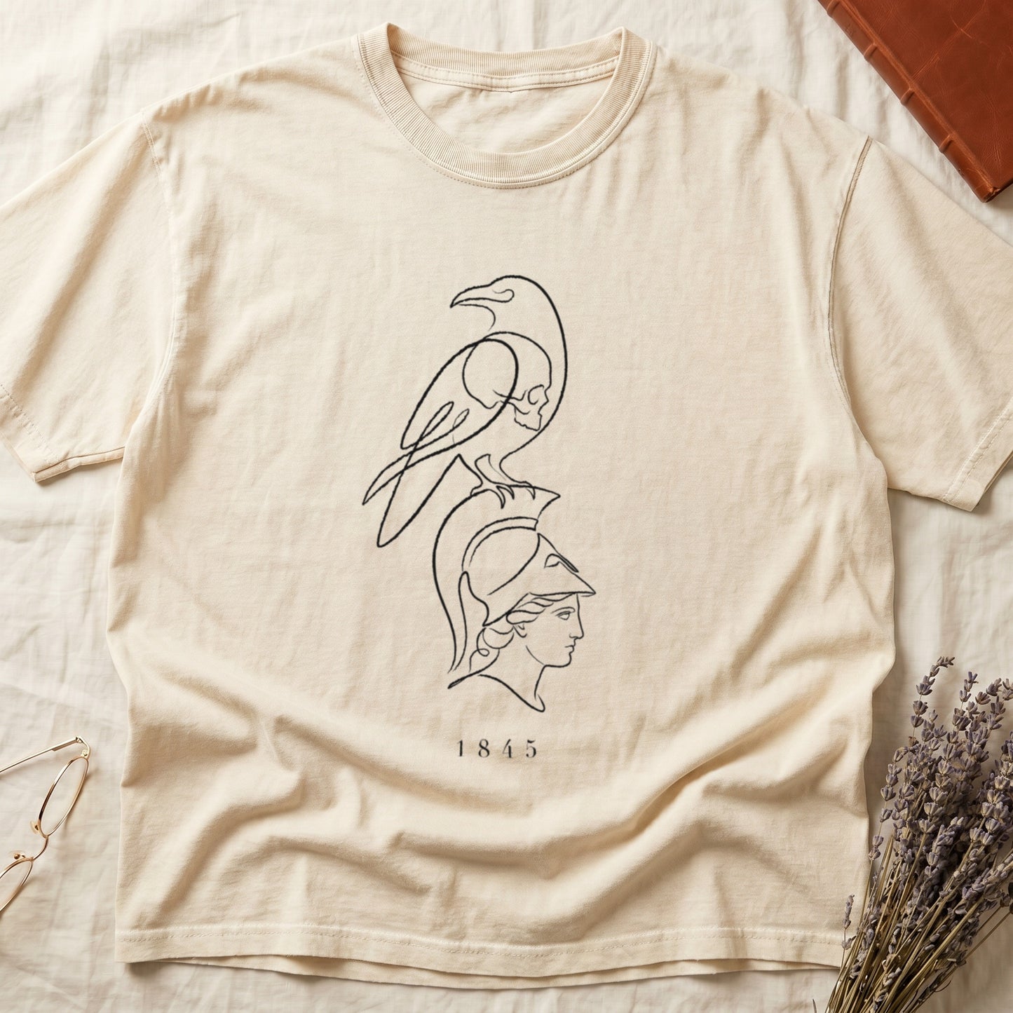 Cream t-shirt with linear raven and profile of helmeted head, printed with "1845".