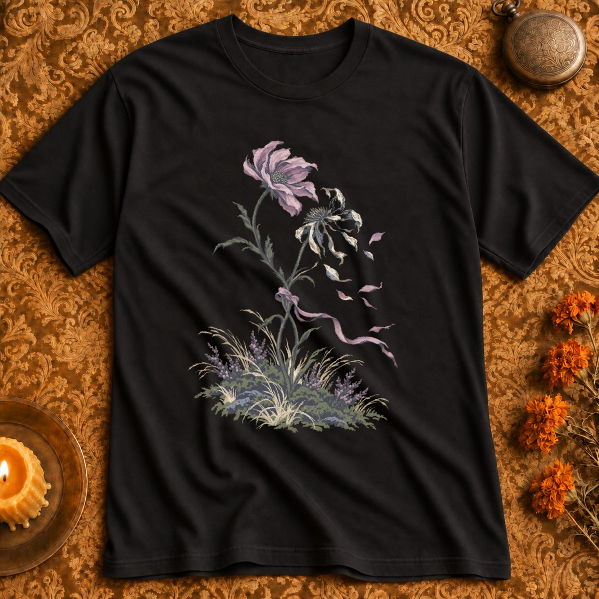Black t-shirt with a floral embroidery design of wilting flowers and grass.