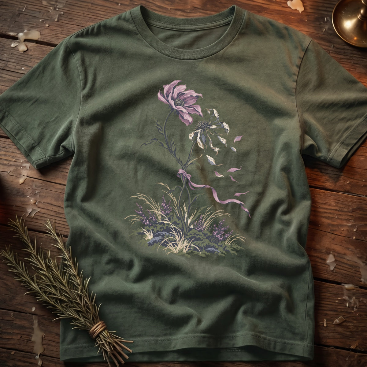 Green t-shirt with a muted floral illustration and ribbon detail.
