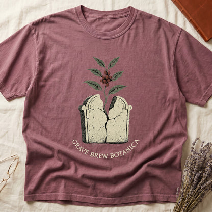 T-shirt with graphic of cracked tombstone with plant growing out, "Grave Brew Botanica" text.