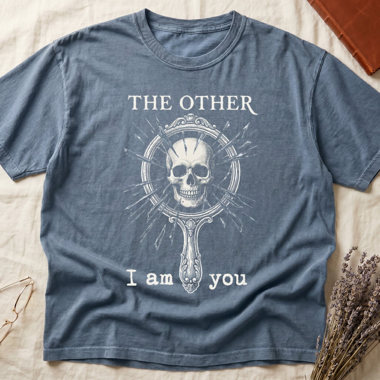 Blue Jean tee with shattered mirror and skull emerging in cream linework, "THE OTHER" top, "I am you" below.