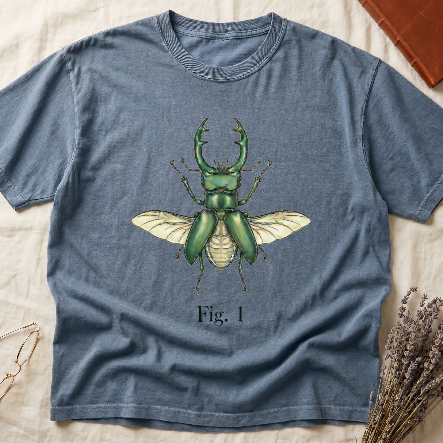 Blue t-shirt with a green stag beetle illustration and "Fig. 1".