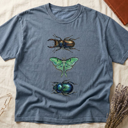 Black tee with three-panel Blue Jean-history plate: stag beetle, luna moth, scarab beetle in ink on yellow ground.