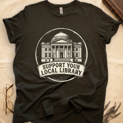 Military Green tee with circular cream badge of a classical library building, "SUPPORT YOUR LOCAL LIBRARY" on a banner below.