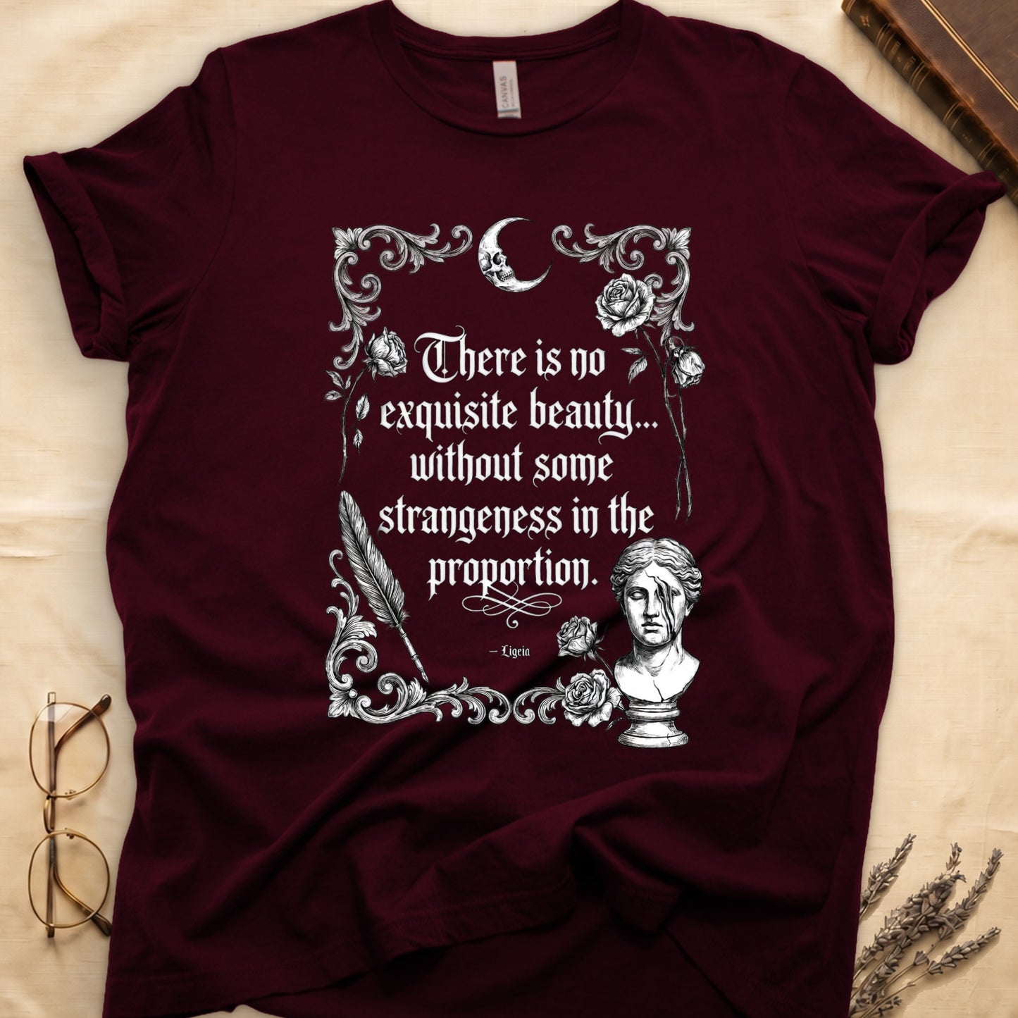 Maroon t-shirt with ornate gothic design featuring a quote and bust.