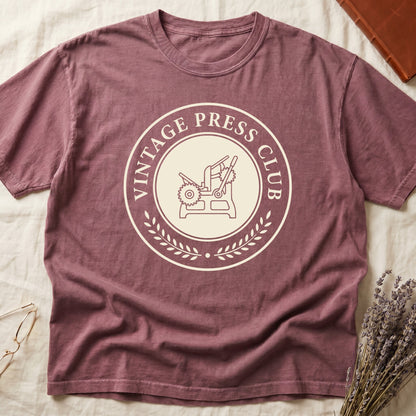 Dark Rose tee with circular letterpress badge, "VINTAGE PRESS CLUB" in serif capitals, antique printing press in cream linework.