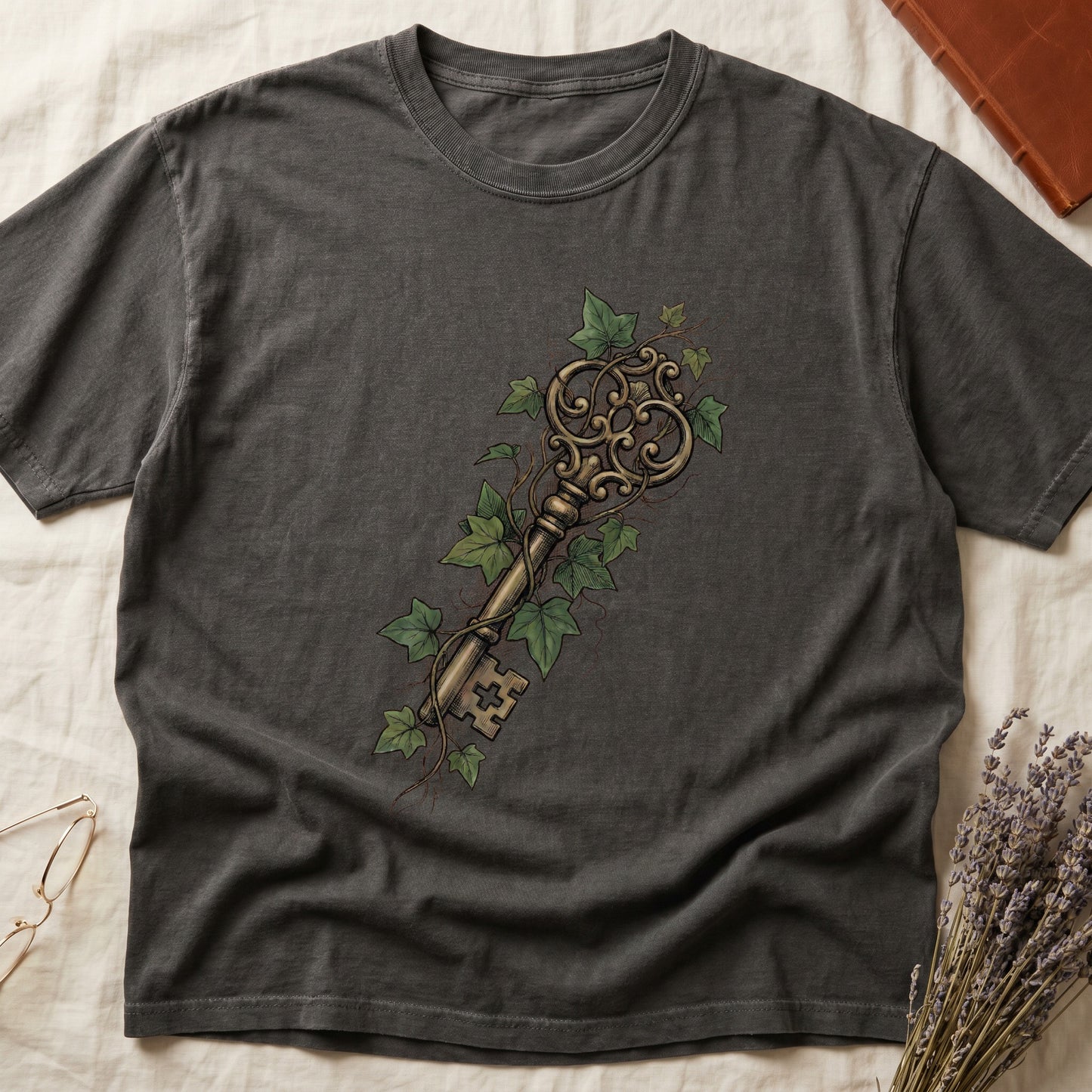Pepper tee with ornate antique skeleton key in bronze, climbing English ivy in green on terracotta ground.