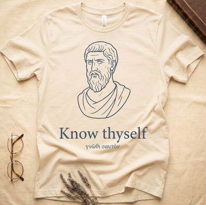 Natural tee with classical Greek philosopher bust in white linework, "Know thyself" in cream serif below.
