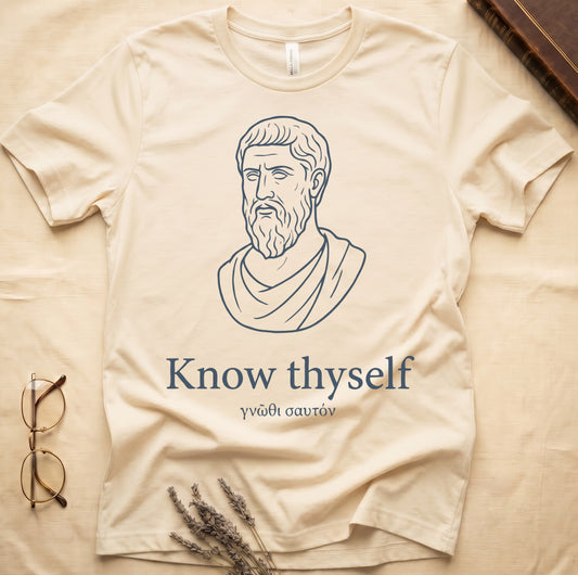 Natural tee with classical Greek philosopher bust in white linework, "Know thyself" in cream serif below.