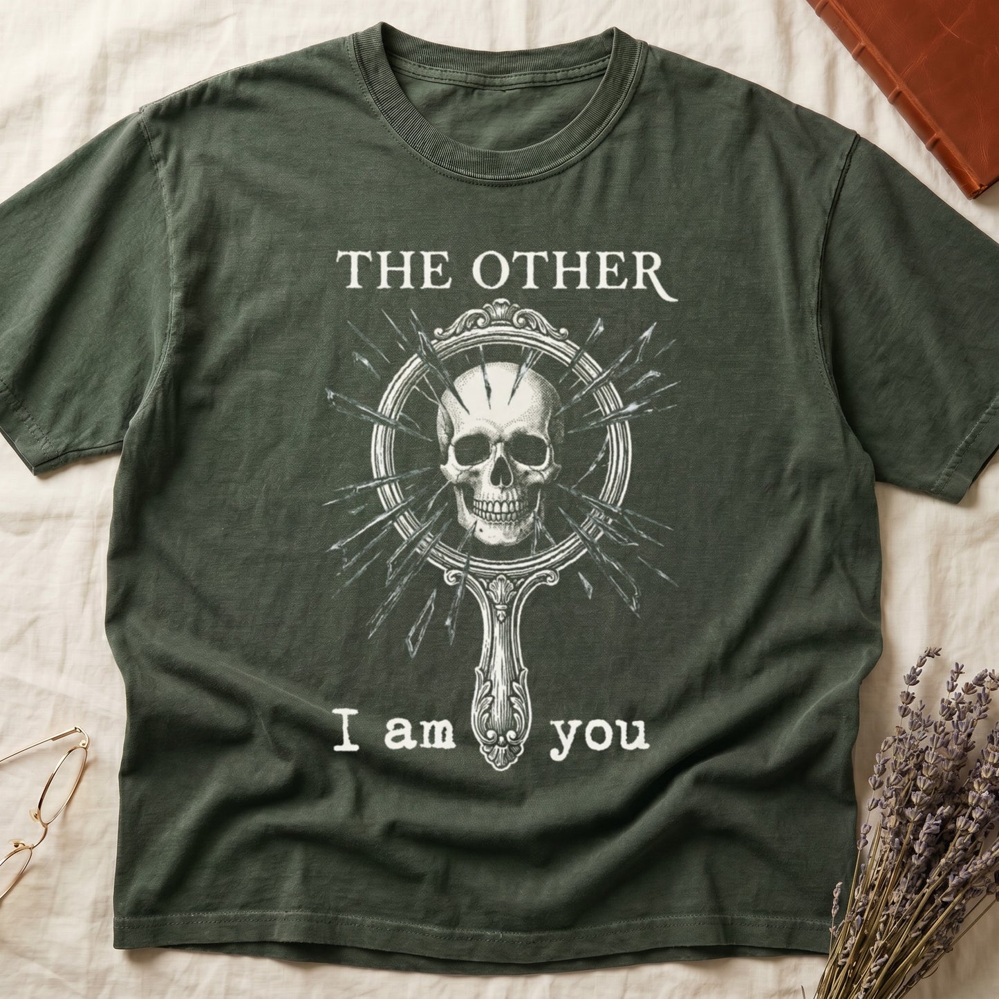 Green tee with shattered mirror and skull emerging in cream linework, "THE OTHER" top, "I am you" below.