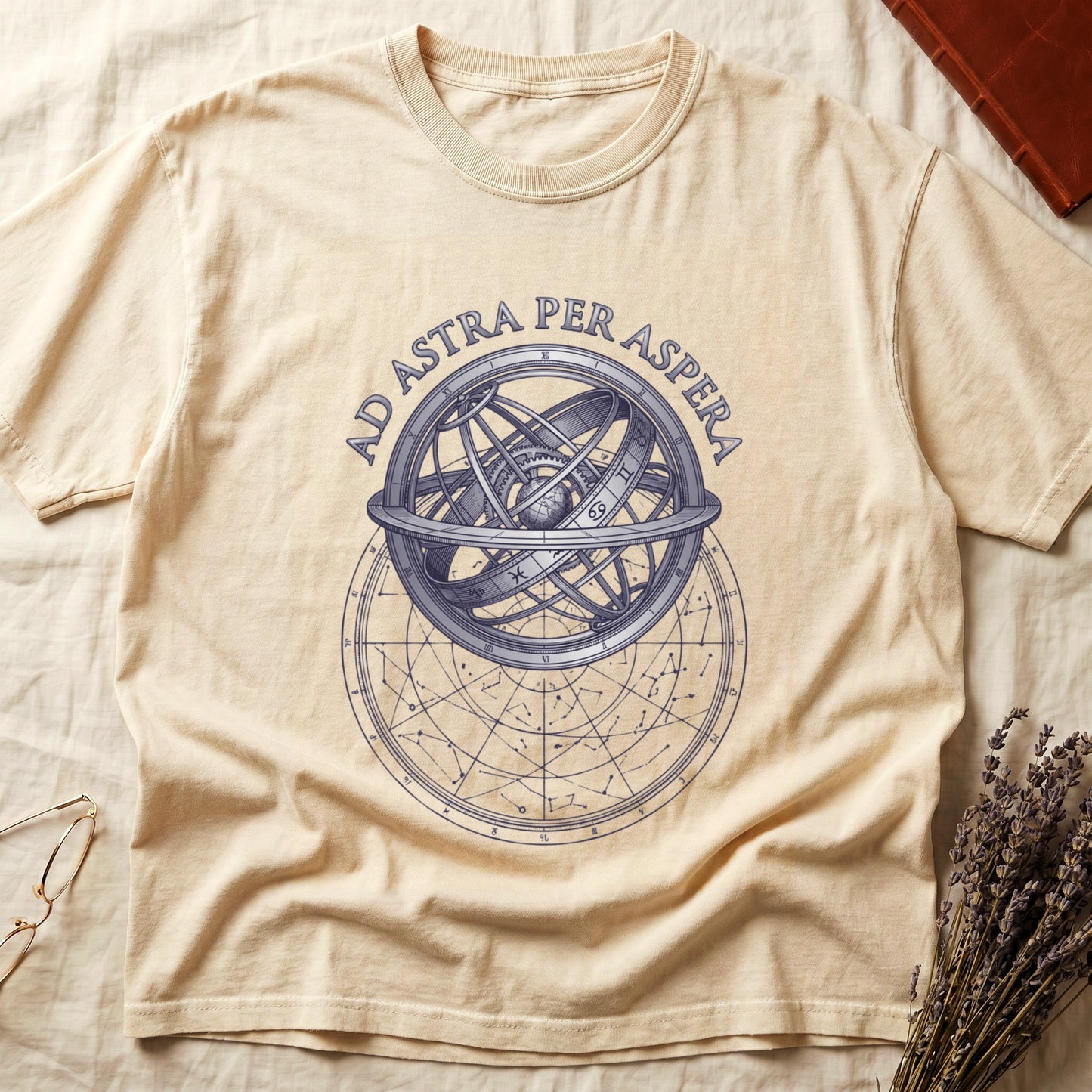 Ivory tee with engraved armillary sphere, "AD ASTRA PER ASPERA" in serif capitals, zodiac symbols, classical astronomy.