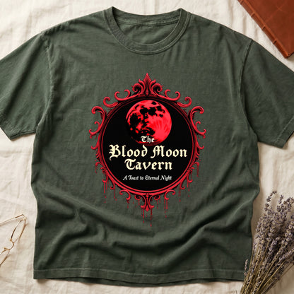 Green tee with red oval frame, blood-red moon, "The Blood Moon Tavern," "A Toast to Eternal Night," red drips below.