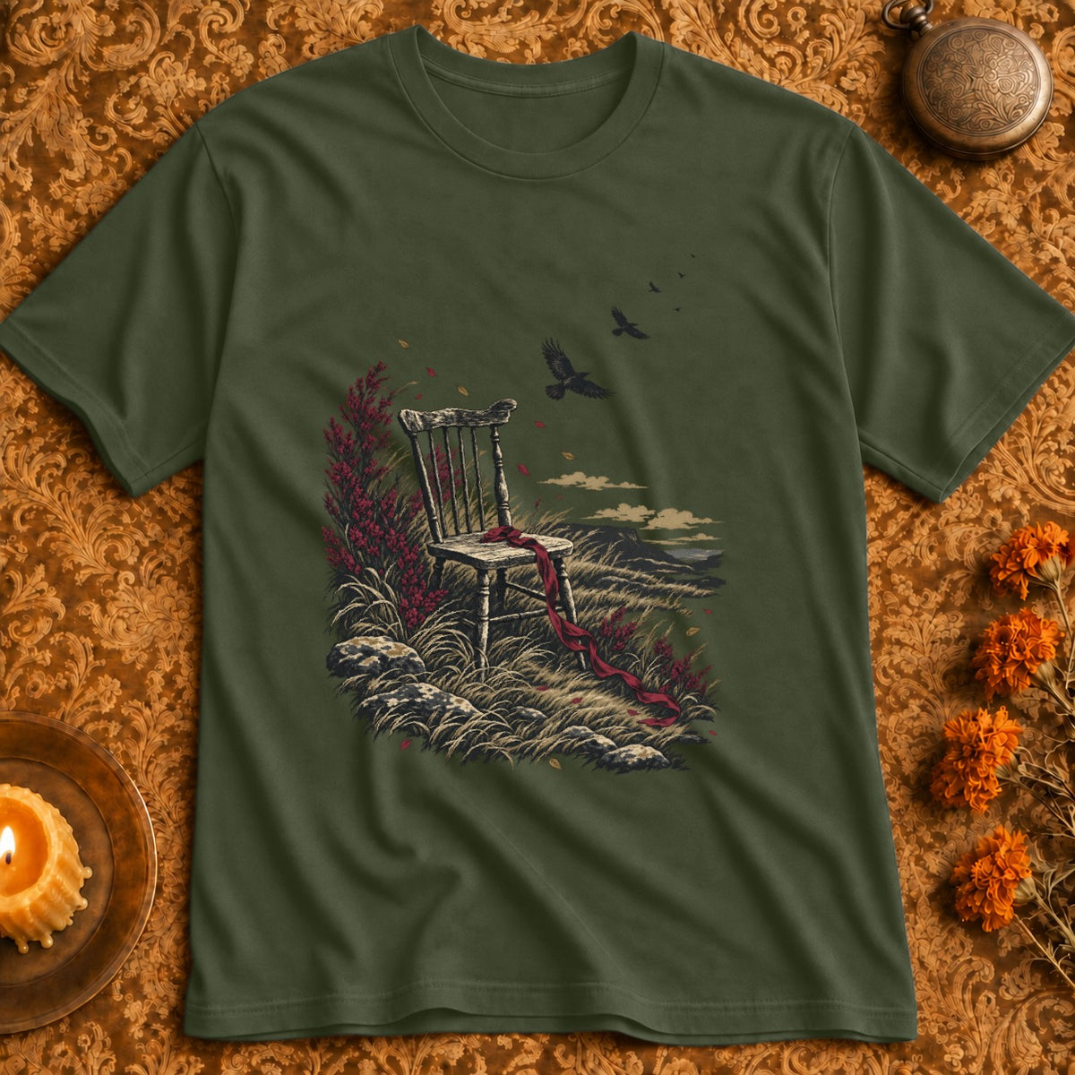 T-shirt with illustration of a wooden chair, red ribbon, grass, and birds in flight.