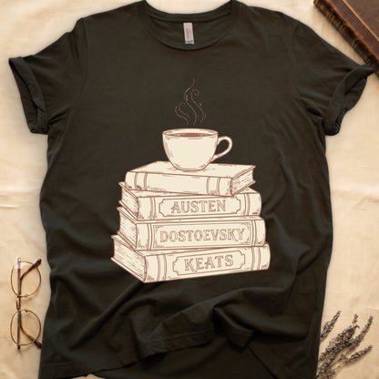 Military Green tee with stack of vintage books labeled "AUSTEN," "DOSTOEVSKY," "KEATS" topped with a steaming coffee cup.