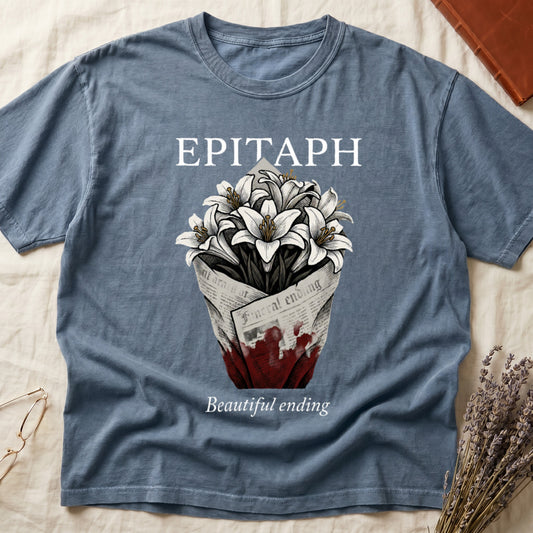 Blue Jean tee with "EPITAPH" over crosshatched white lilies in blood-stained newsprint wrap, "Beautiful ending" italic serif.