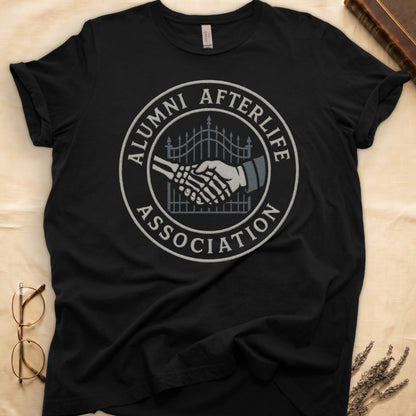 Military Green tee with embroidered patch, skeletal handshake at cemetery gate, "ALUMNI AFTERLIFE" top, "ASSOCIATION" bottom.