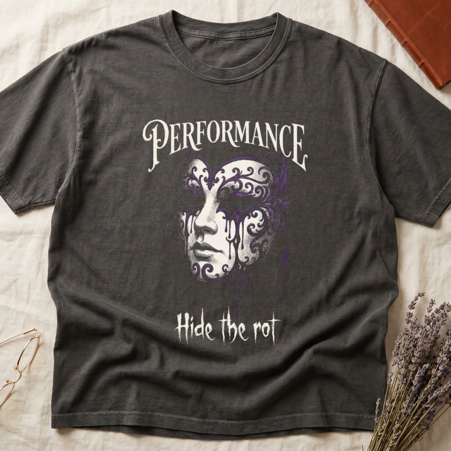 Pepper tee with ornate Venetian mask in cream and purple filigree dripping ink, "PERFORMANCE" top, "Hide the rot" below.