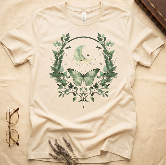 Cream t-shirt with moon, butterfly, and leafy wreath graphic and numbers 50 and 12.