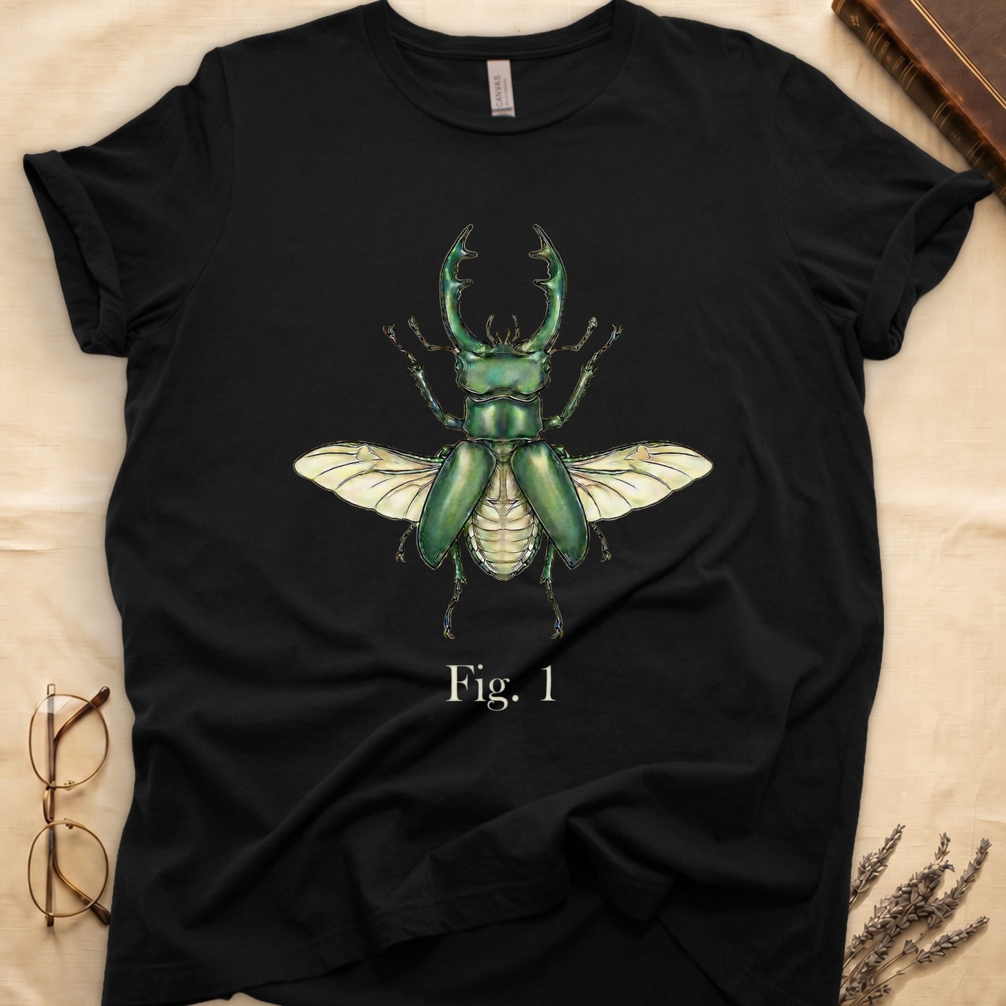 Black t-shirt with a green stag beetle illustration and text "Fig. 1"