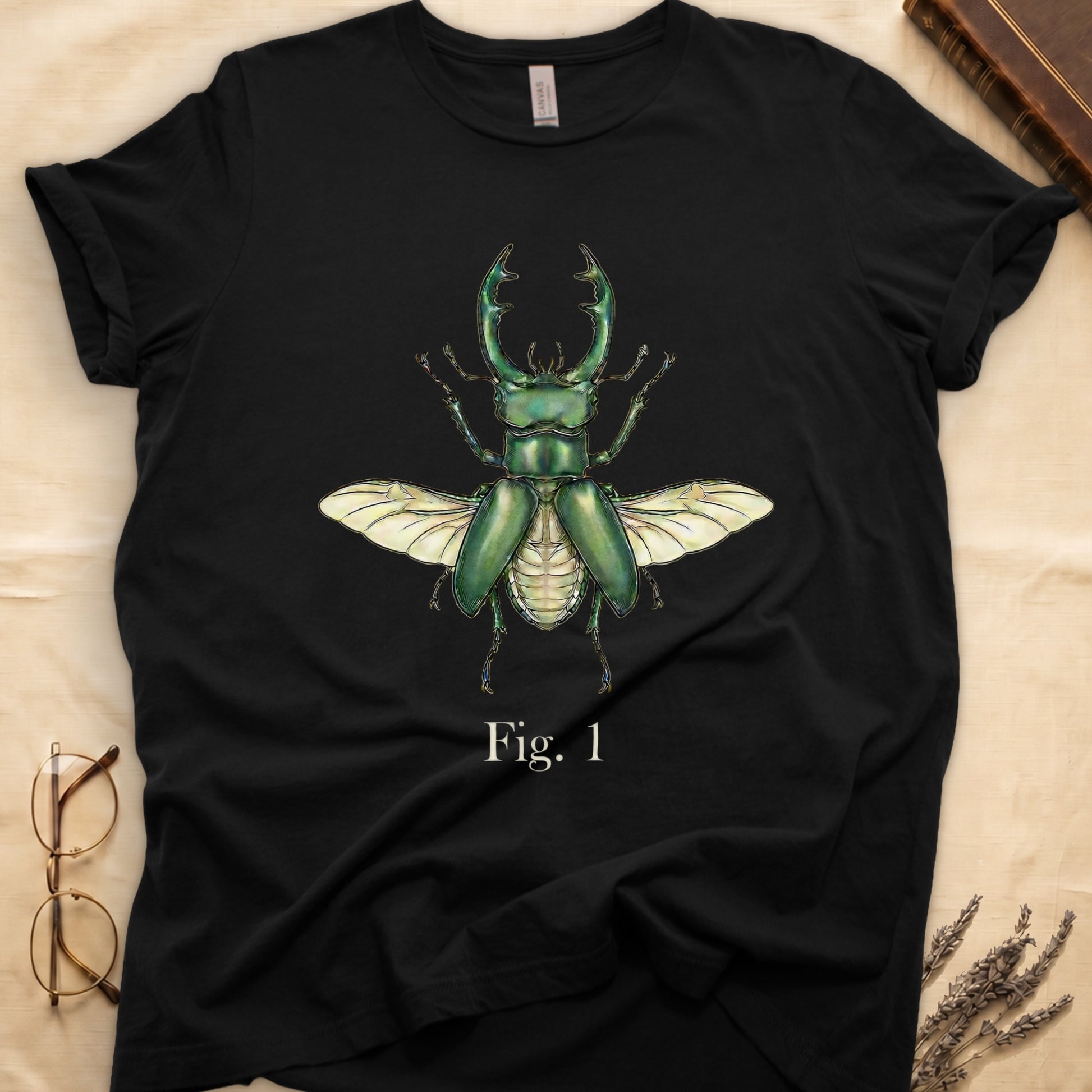Black t-shirt with a green stag beetle illustration and text "Fig. 1"