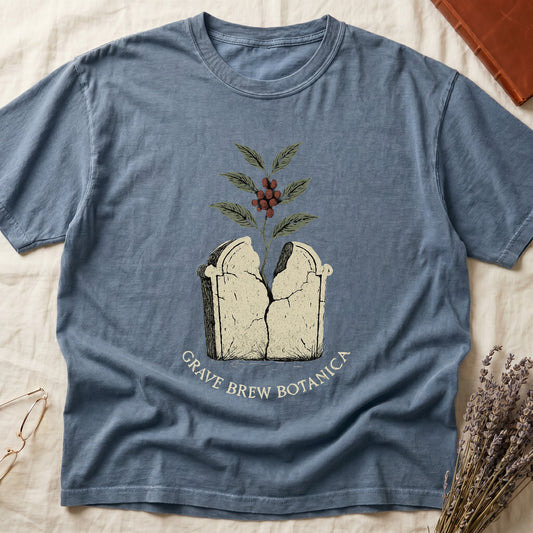 Blue t-shirt with "Grave Brew Botanica" text and cracked tombstone graphic.