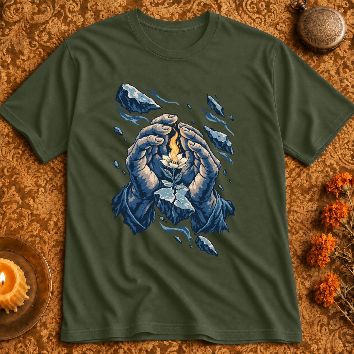 Green t-shirt with illustration of hands protecting a glowing flower surrounded by ice.