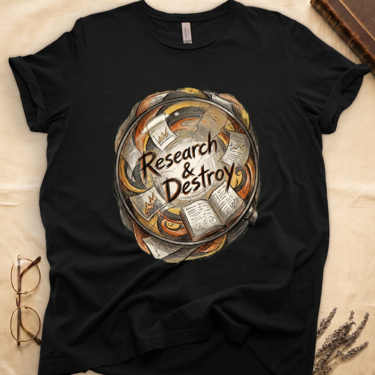 Black tee with globe of papers, open books, charts in colored ink, "Research & Destroy" in cursive at center.
