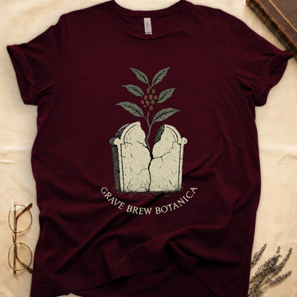 Maroon t-shirt with cracked tombstone graphic and coffee plant.