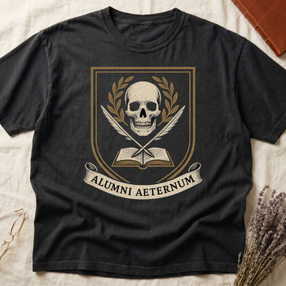 Black tee with heraldic shield, skull and gold laurels, crossed quills, open book, scroll "ALUMNI AETERNUM" below.