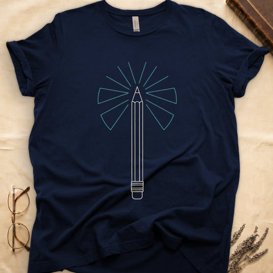Navy tee with single vertical graphite pencil in cream linework, fan of teal and grey rays radiating behind.