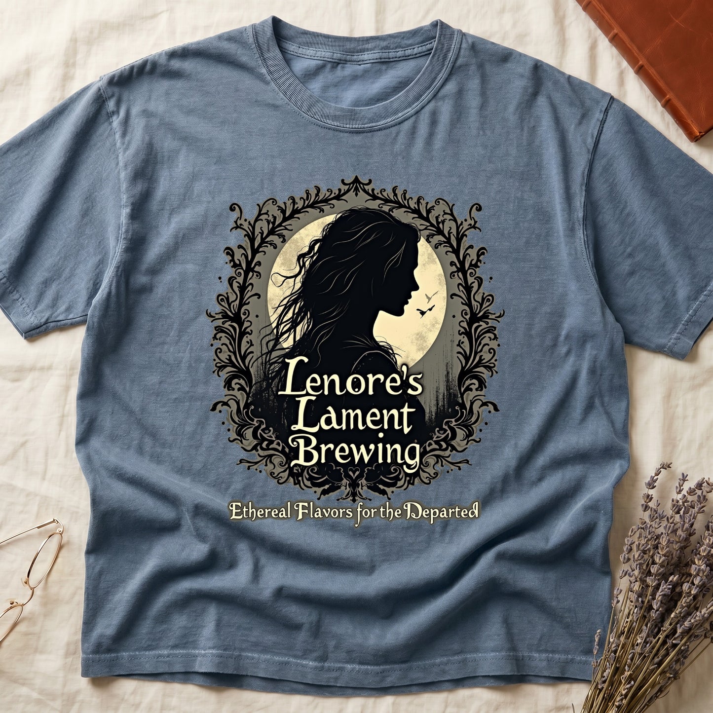 Blue Jean tee with sage label, Lenore silhouette and moon, "Lenore's Lament Brewing," "Ethereal Flavors for the Departed."