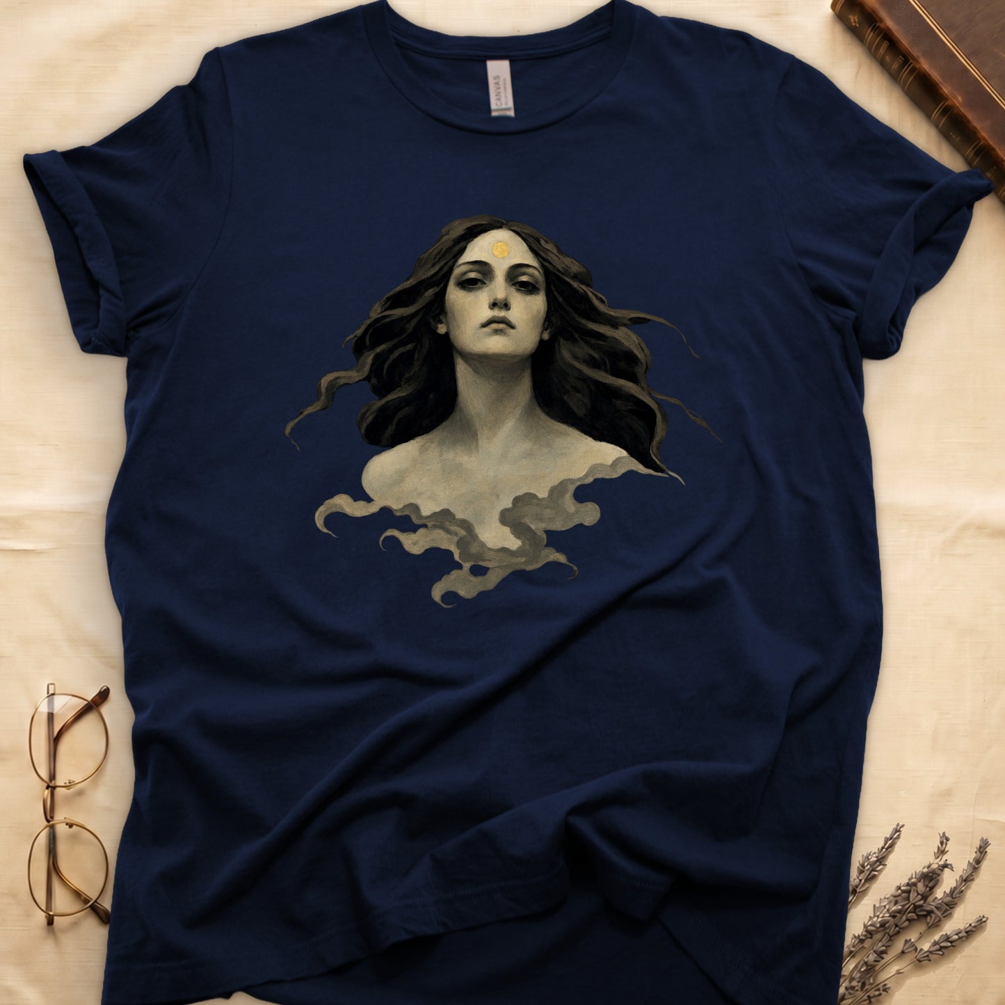 Dark blue t-shirt with a painting of a woman with a golden sun on her forehead.