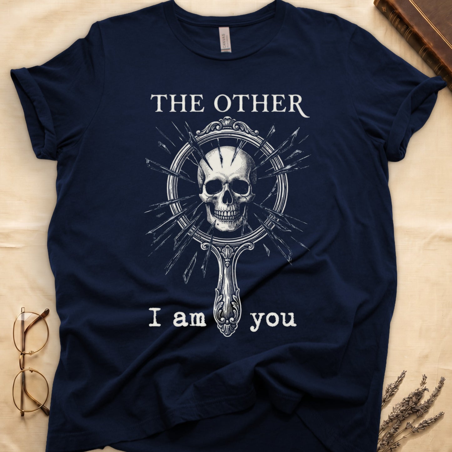 Navy tee with shattered mirror and skull emerging in cream linework, "THE OTHER" top, "I am you" below.
