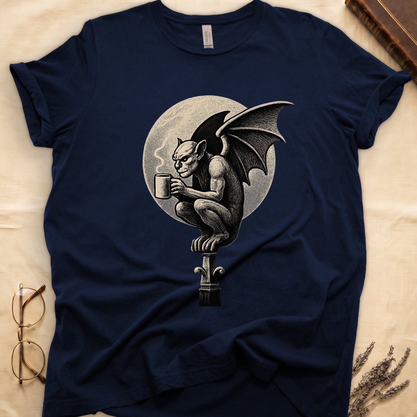 Navy tee with gargoyle on stone pinnacle holding coffee mug, cream-parchment full moon behind, engraving style.