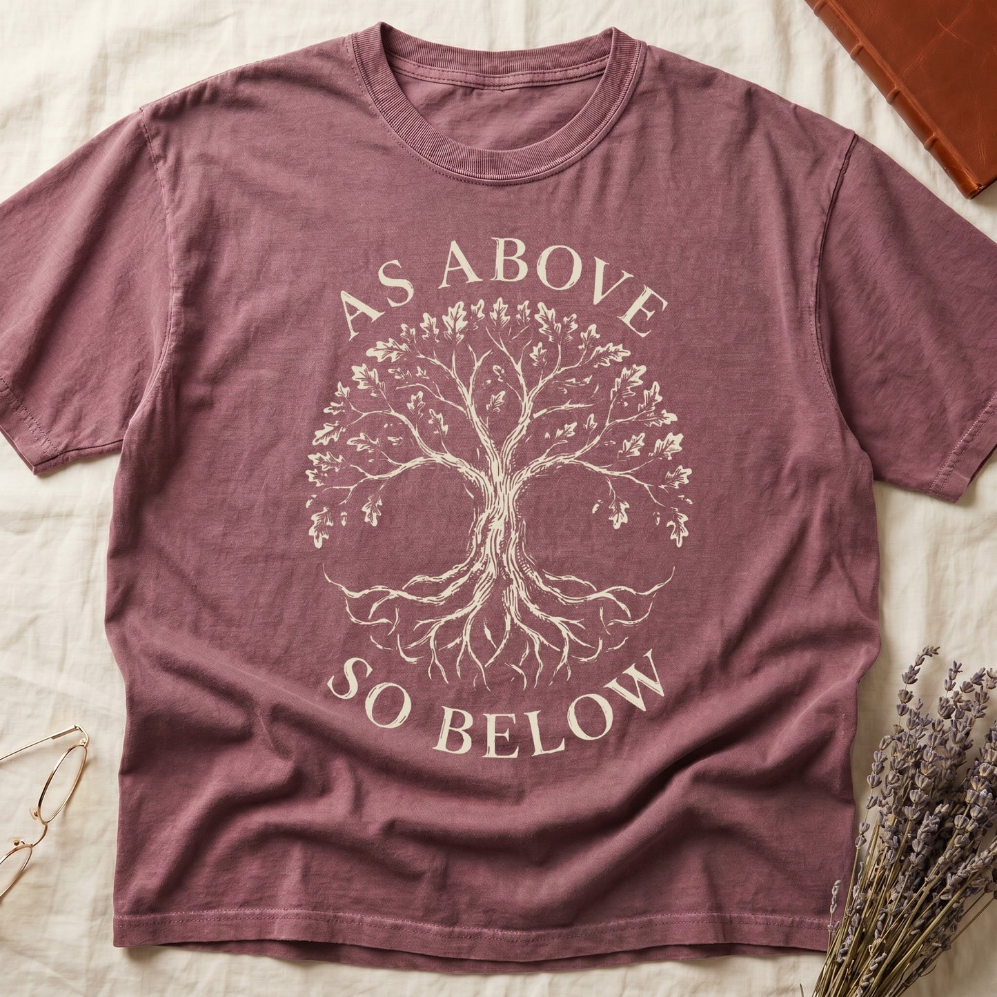 Dark Rose tee with Tree of Life in cream linework, mirrored canopy and roots, "AS ABOVE" and "SO BELOW" in serif arcs.