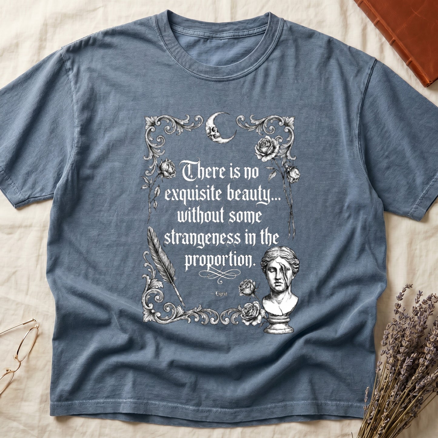 Blue t-shirt with quote "There is no exquisite beauty... without some strangeness in the proportion."