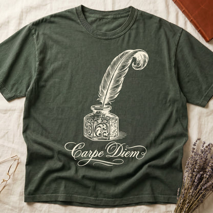 Green tee with ornate antique inkwell and quill pen in sepia linework, "Carpe Diem" in flowing cursive below.
