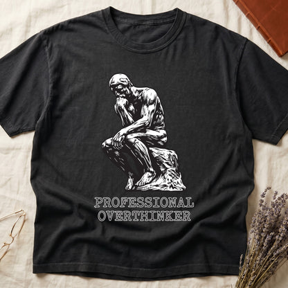 Black tee with monochrome rendering of Rodin's Thinker, "PROFESSIONAL OVERTHINKER" in serif capitals below.