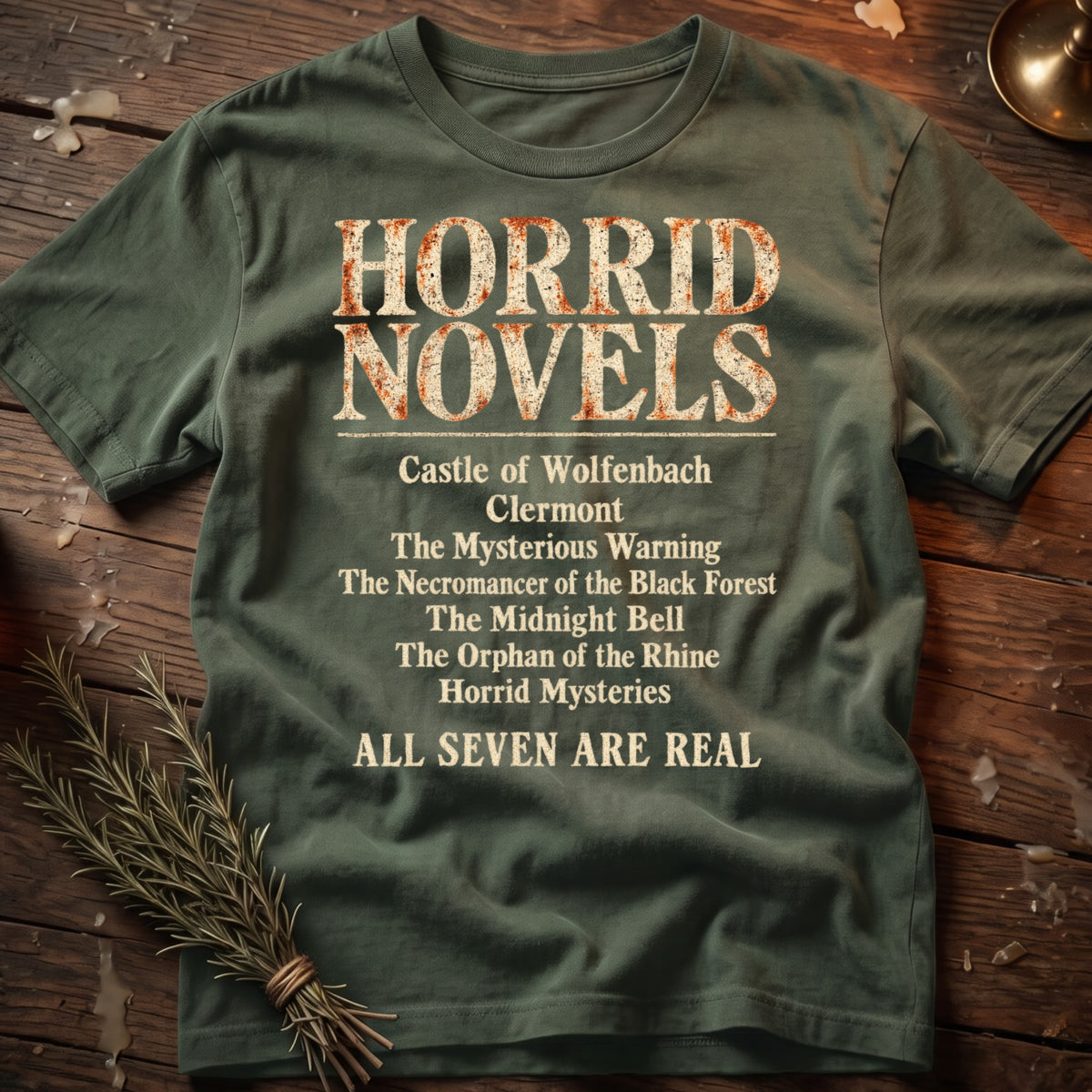Olive green t-shirt with "HORRID NOVELS" and a list of book titles.