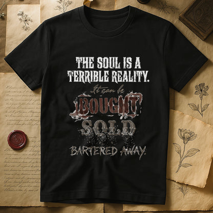 Natural tee with distressed western type, "THE SOUL IS A TERRIBLE REALITY. It can be BOUGHT SOLD BARTERED AWAY."