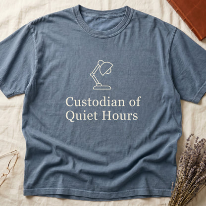 Blue Jean tee with vintage desk lamp in cream linework above "Custodian of Quiet Hours" in distressed Art Deco caps.