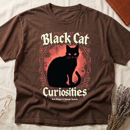 Espresso tee with black cat, red eyes, red-orange moon, "Black Cat Curiosities," "Dark Whispers & Midnight Mysteries."