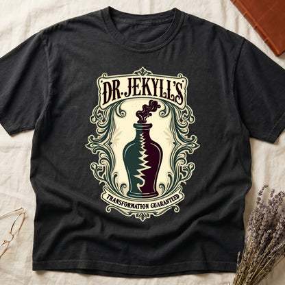 Black tee with apothecary label, green elixir bottle, lightning bolt, smoke, "DR. JEKYLL'S," "TRANSFORMATION GUARANTEED."