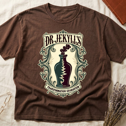Espresso tee with apothecary label, green elixir bottle, lightning bolt, smoke, "DR. JEKYLL'S," "TRANSFORMATION GUARANTEED."