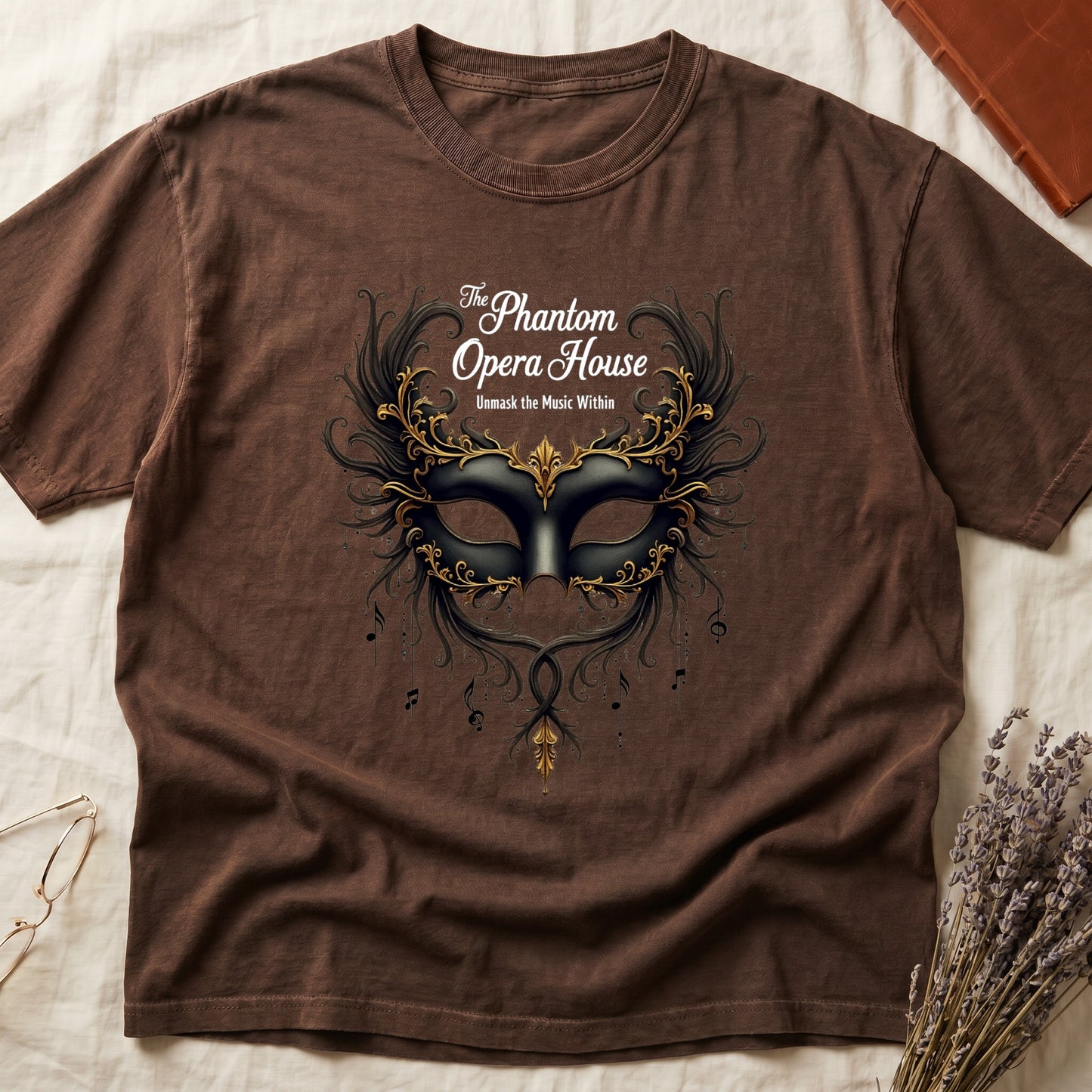 Espresso tee with gold-and-black masquerade mask, scrollwork wings, "The Phantom Opera House," "Unmask the Music Within."
