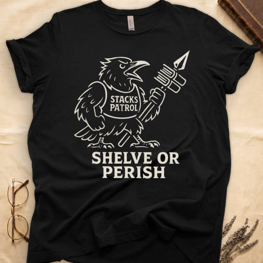 Black tee with vintage raven mascot, "STACKS PATROL" sash, feather pen aloft, "SHELVE OR PERISH" bold serif below.